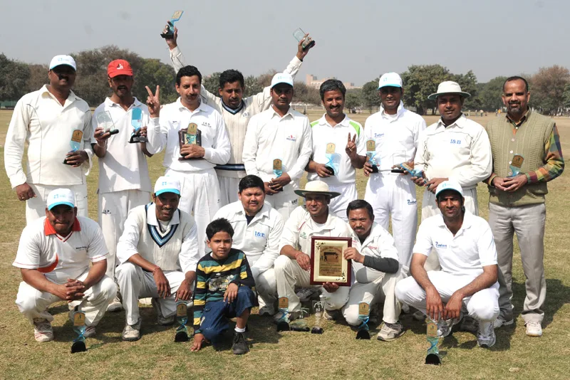 The Ministry of I&B Cricket team posing with Inter Media Cricket Tournament-2011 Trophy, organized by..