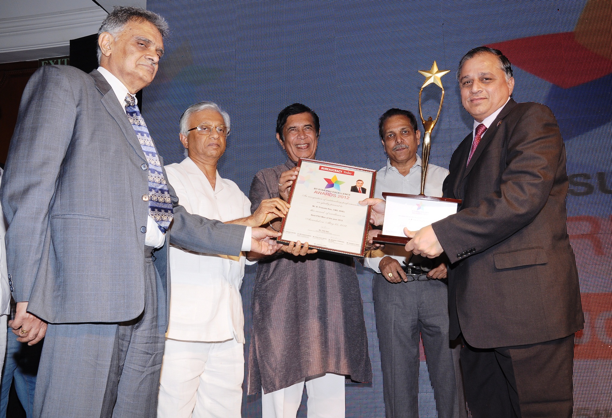 Mr. B. Prasada Rao, CMD, BHEL, receiving the 'BT-Star Best PSU Man....