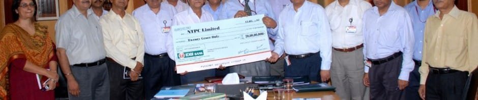 Anil Agrawal CEO, NVVN presenting a dividend cheque of Rs.20 crore to...
