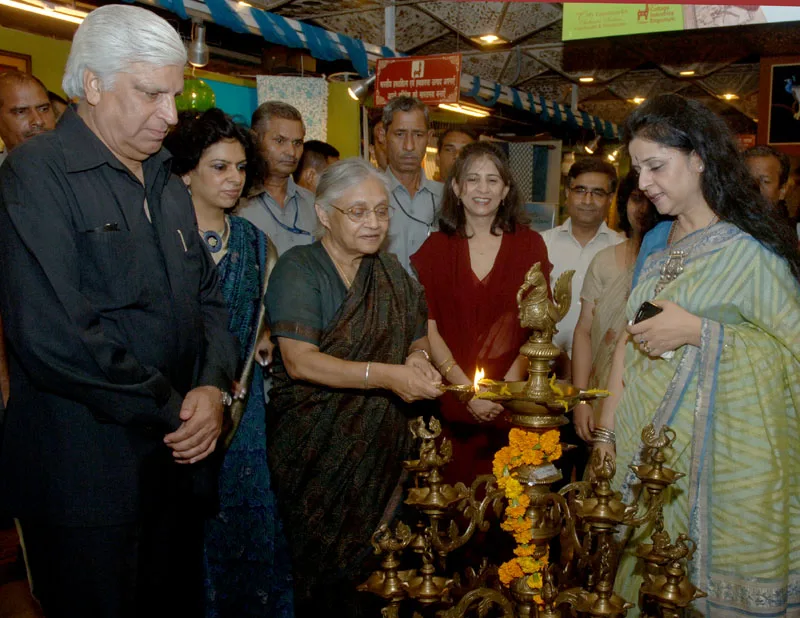 The Chief Minister of Delhi, Smt. Sheila Dikshit lighting the lamp to…
