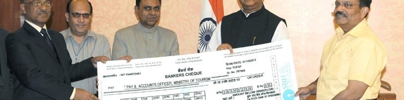 The CMD, ITDC, Shri Lalit Panwar presenting a dividend cheque to...