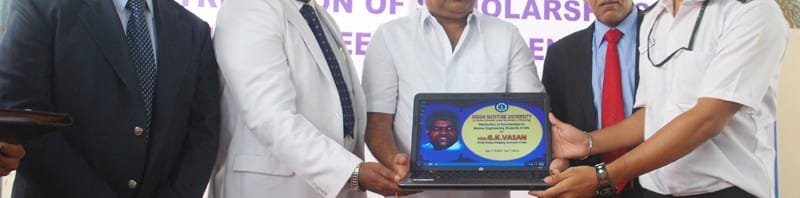 The Union Minister for Shipping, Shri G.K. Vasan distributing a Laptop to a Marine...