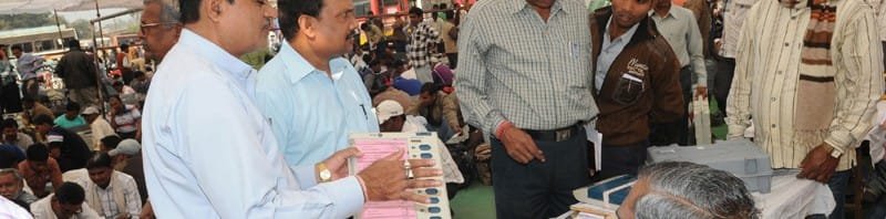 Polling officials receiving the Electronic Voting Machines (EVM`s) and inspect the same in...