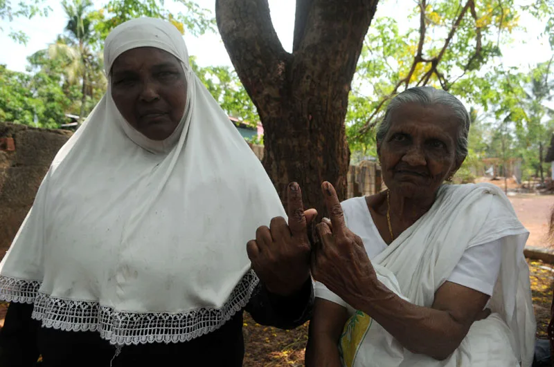 The old Woman voters showing mark of indelible ink after casting her vote,…