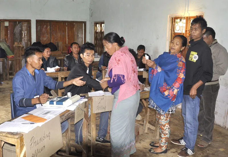 The voters at a polling booth to cast their votes for the General Elections-2014, …