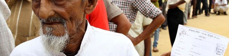 Voters standing in a queue at a polling booth to cast their votes during the...