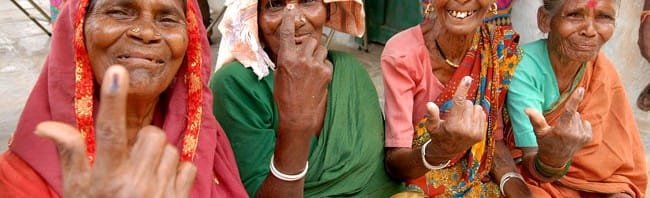 The elderly female voters showing mark of indelible ink after cast their votes,...