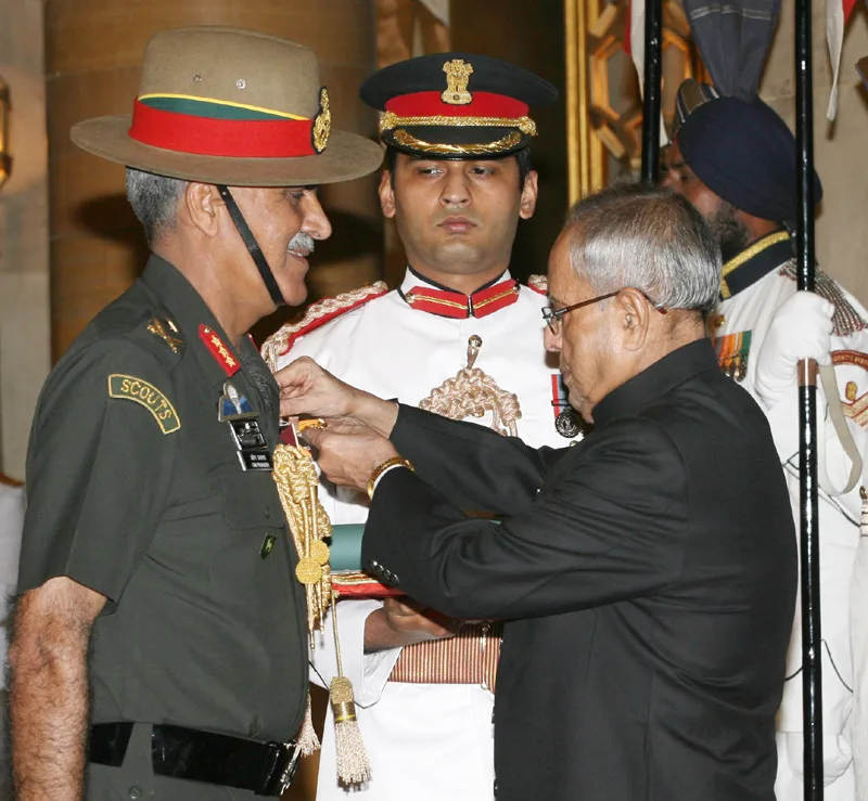 The President, Shri Pranab Mukherjee presenting the Uttam Yudh Seva Medal to..