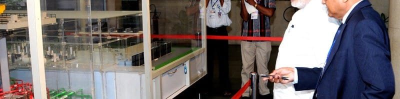 The Prime Minister, Shri Narendra Modi being briefed by the Secretary DAE and...