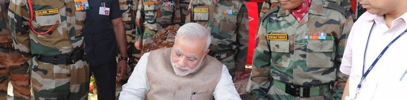 The Prime Minister, Shri Narendra Modi writes in the Visitors Book at 14 Corps HQ. , at Leh