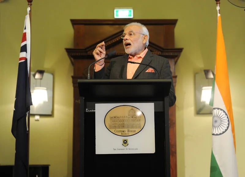 The Prime Minister, Shri Narendra Modi delivering his address at the business breakfast ..