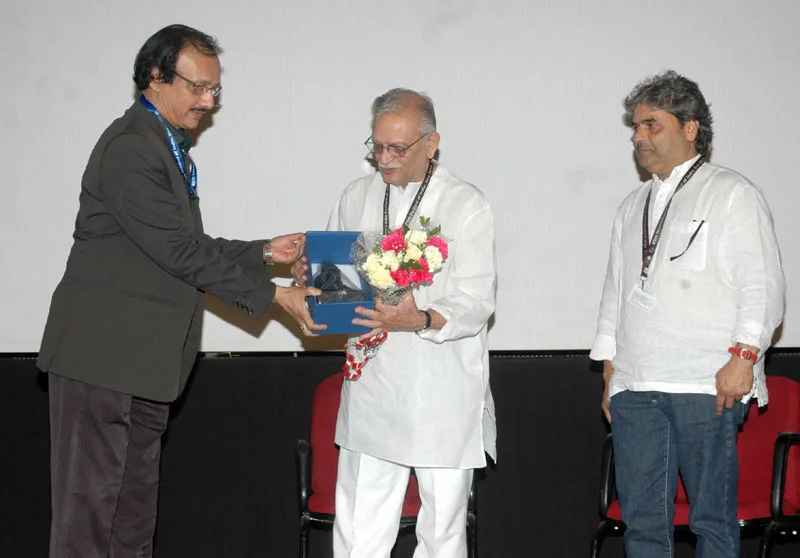 The Director, IFFI, Shri Shankar Mohan felicitating the veteran film lyricist, director,..