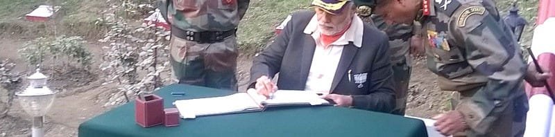 The Prime Minister, Shri Narendra Modi signing the visitors book at Martyrs Memorial,..