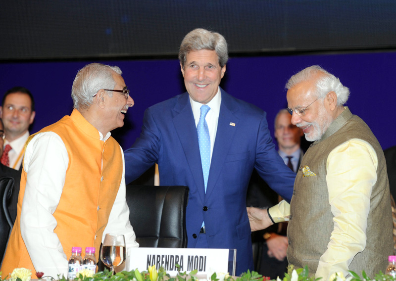 The Prime Minister, Shri Narendra Modi with the US Secretary of State, Mr. John Kerry, at the..