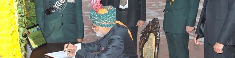The Prime Minister, Shri Narendra Modi writing on the visitor’s book at ...