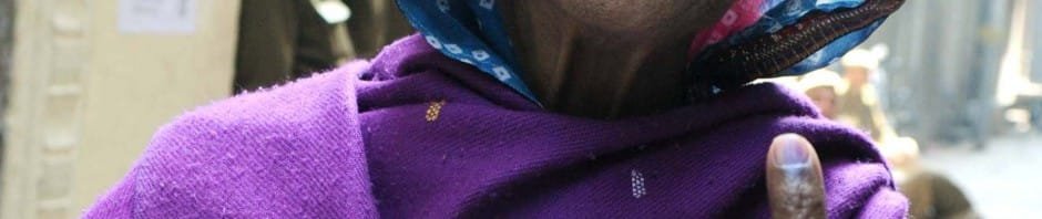 An Elderly woman voter showing mark of indelible ink after casting ..