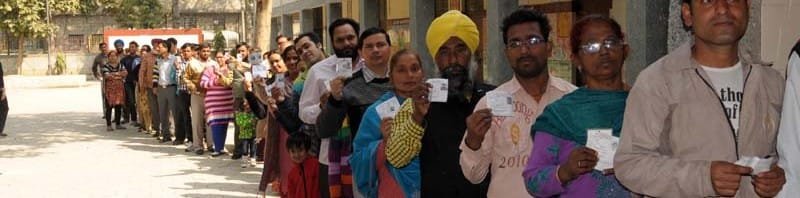 A long queue of voters to cast their votes for the Delhi Assembly Election, in New Delhi
