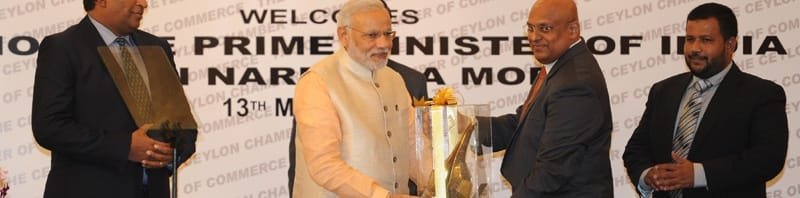 The Prime Minister, Shri Narendra Modi being presented a memento, at the business meeting..