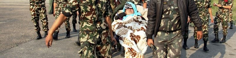 The Indian Air Force (IAF) and Nepal army personnel helping a stranded woman..