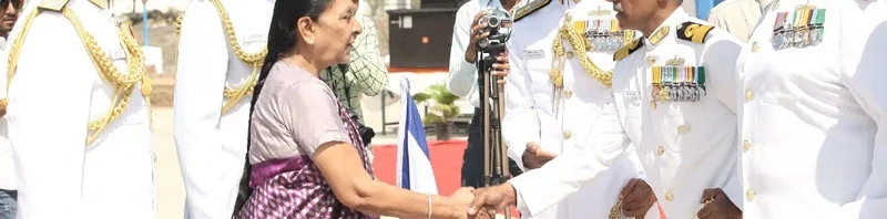 The Chief Minister of Gujarat, Smt. Anandiben Patel congratulating Commodore B.R. Prakash, during ..