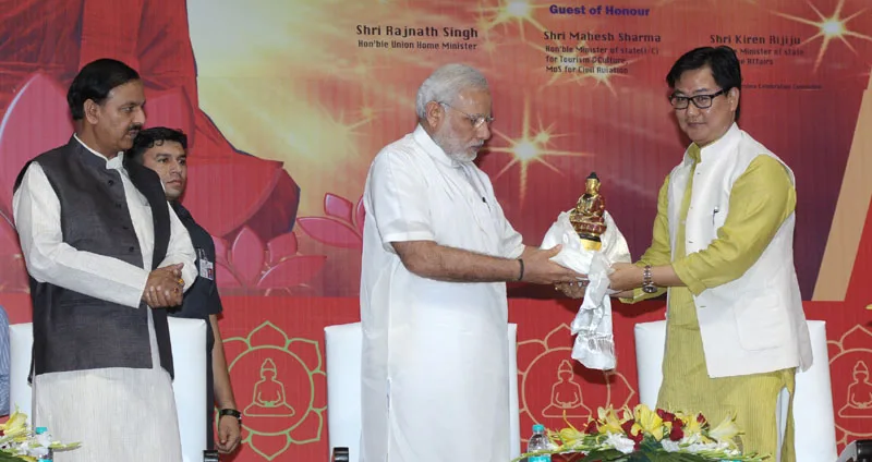 The Prime Minister, Shri Narendra Modi being presented a memento and “Khata” a ..