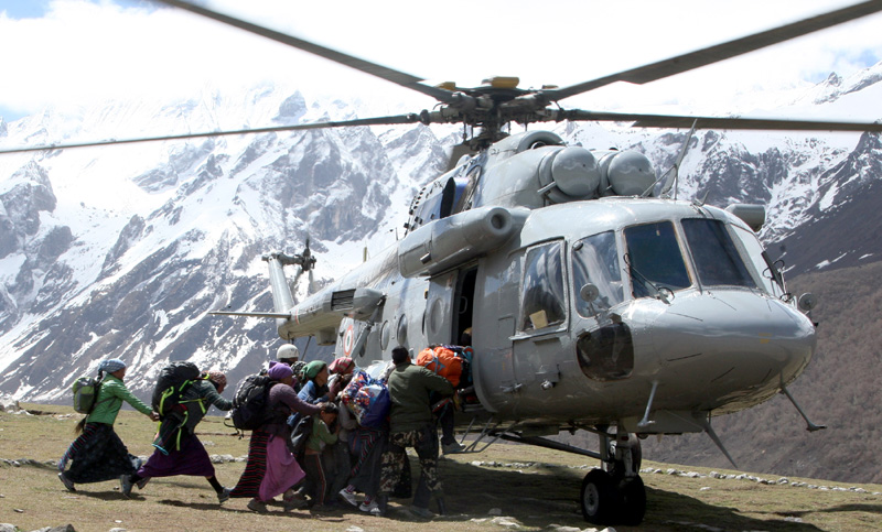 Local Nepalese and Army persons being evacuated by An Indian Air Force (IAF) Mi-17 V5..