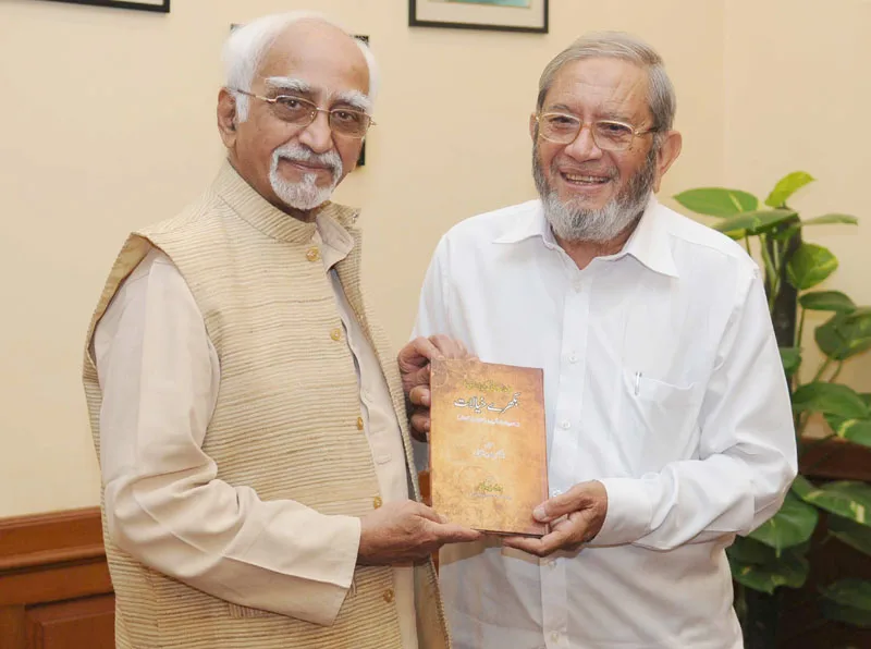 The Vice President, Shri Mohd. Hamid Ansari being presented a book entitled..