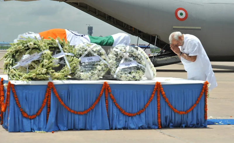 The Prime Minister, Shri Narendra Modi paying homage at the mortal remains of..
