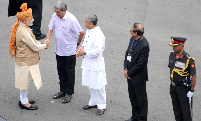 The Prime Minister, Shri Narendra Modi being received by the Union Minister for Defence,..