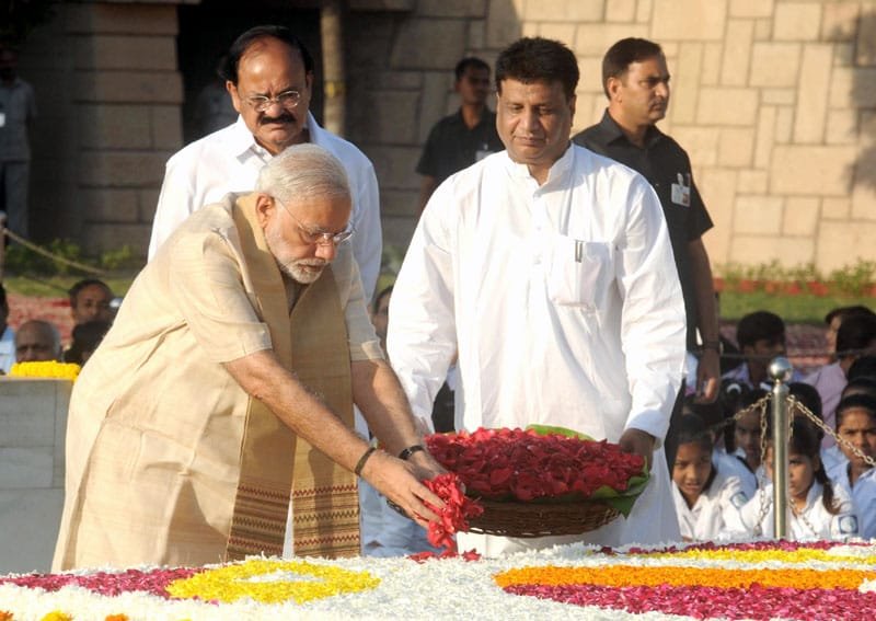 The Prime Minister, Shri Narendra Modi paying floral tributes at the Samadhi of ..