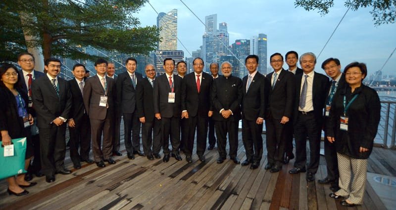 The Prime Minister, Shri Narendra Modi in a group photograph with the Singaporean investors,..