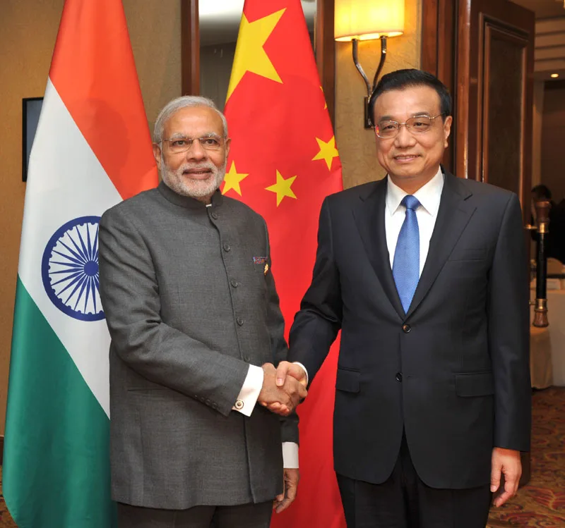 The Prime Minister, Shri Narendra Modi meeting the Prime Minister of China, Mr. Li Keqiang, at ..