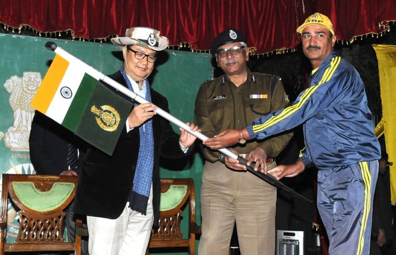 The Minister of State for Home Affairs, Shri Kiren Rijiju being presented a flag by ..