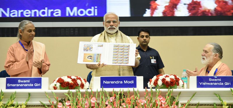 The Prime Minister, Shri Narendra Modi releasing the Special Commemorative..