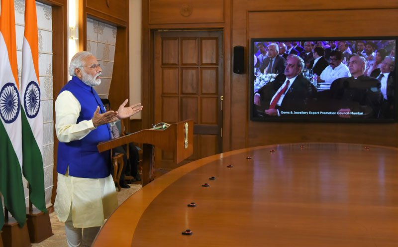 The Prime Minister, Shri Narendra Modi addressing the International..